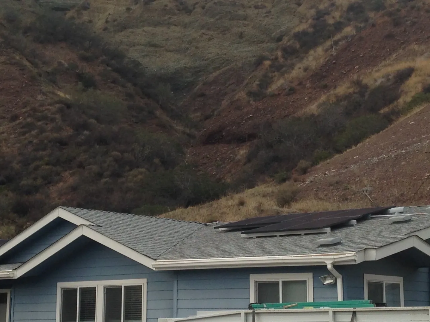 A house with a mountain in the background